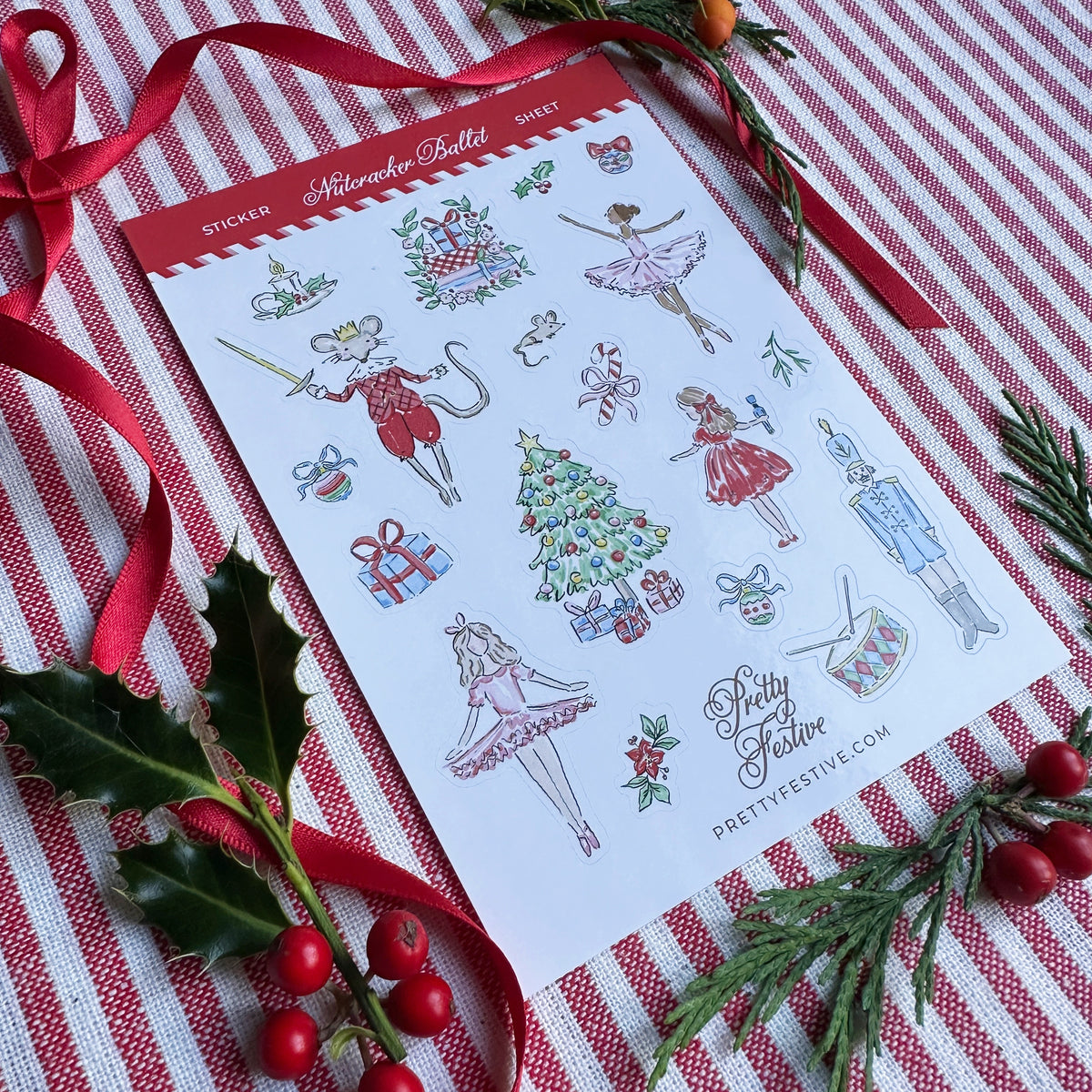 A6 Sticker Sheet caption Nutcracker Ballet featuring several Christmas Nutcracker Ballet themed illustrations. Background is red and white striped fabric, red ribbon and foliage and berries